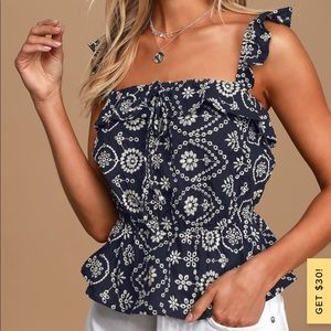 Embroidered sleeveless ruffled top